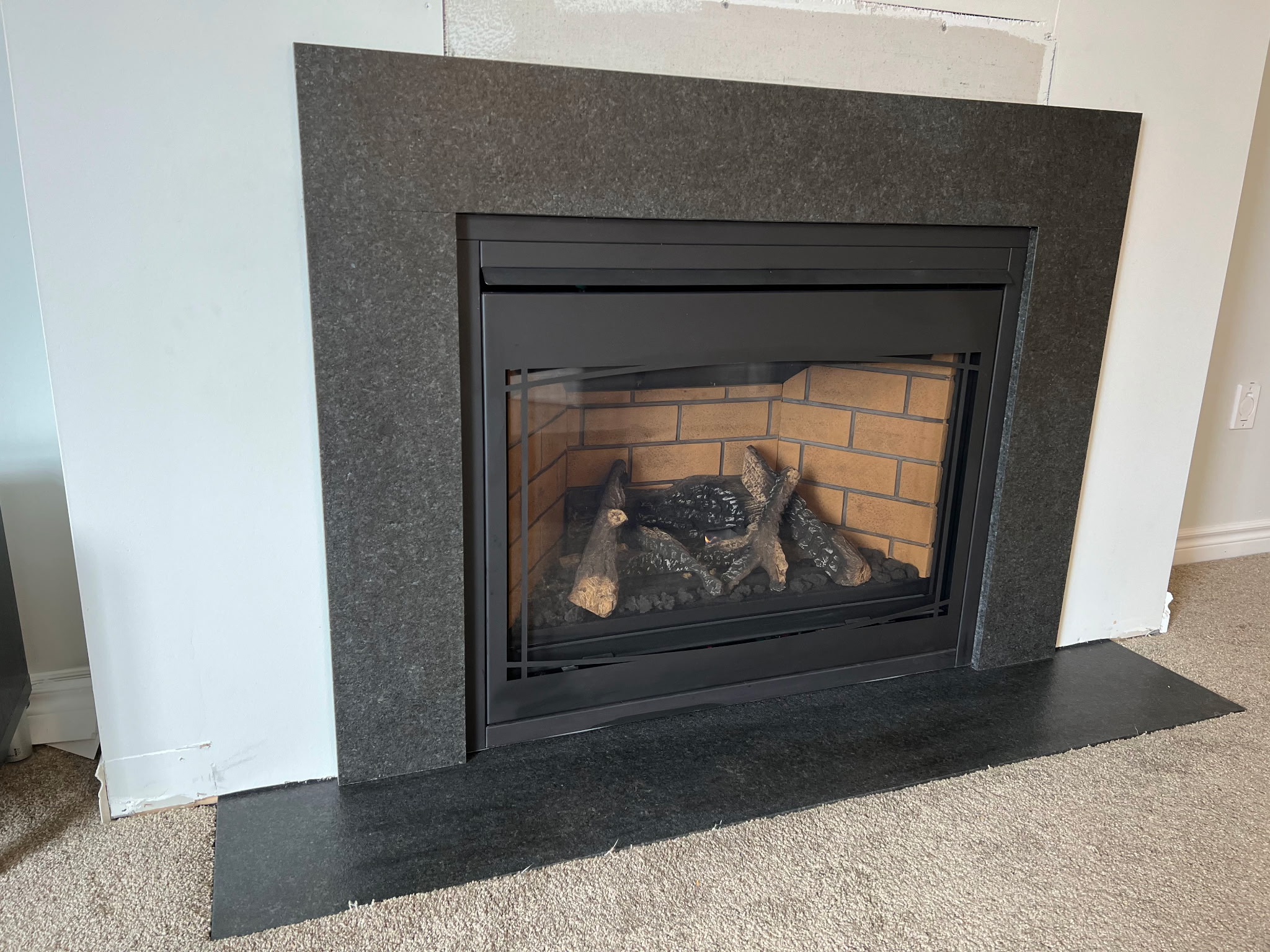 Granite fireplace surround installation